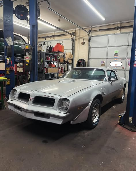 Silver 1976 Pontiac Trans Am in the shop after a full mechanical refresh